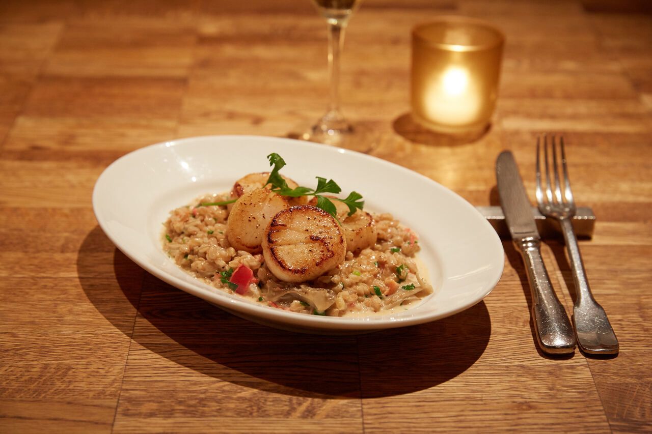 Dinner course with a Cheers Sparkling Wine at Indoor Dining Table